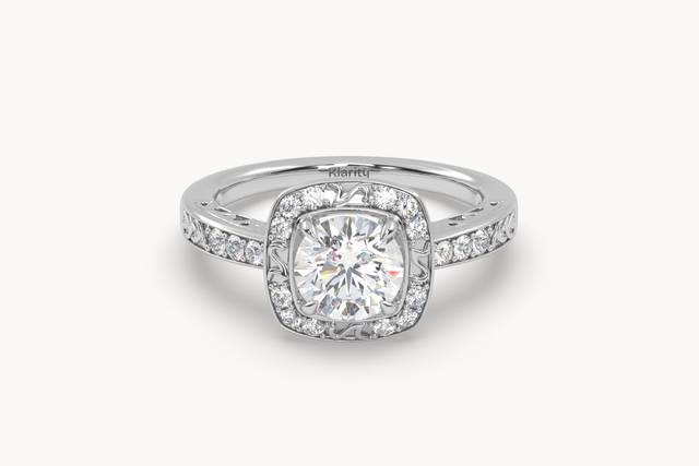 Cushion halo engagement ring with diamond band