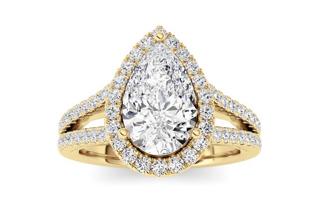 Pear halo split shank engagement ring in yellow gold