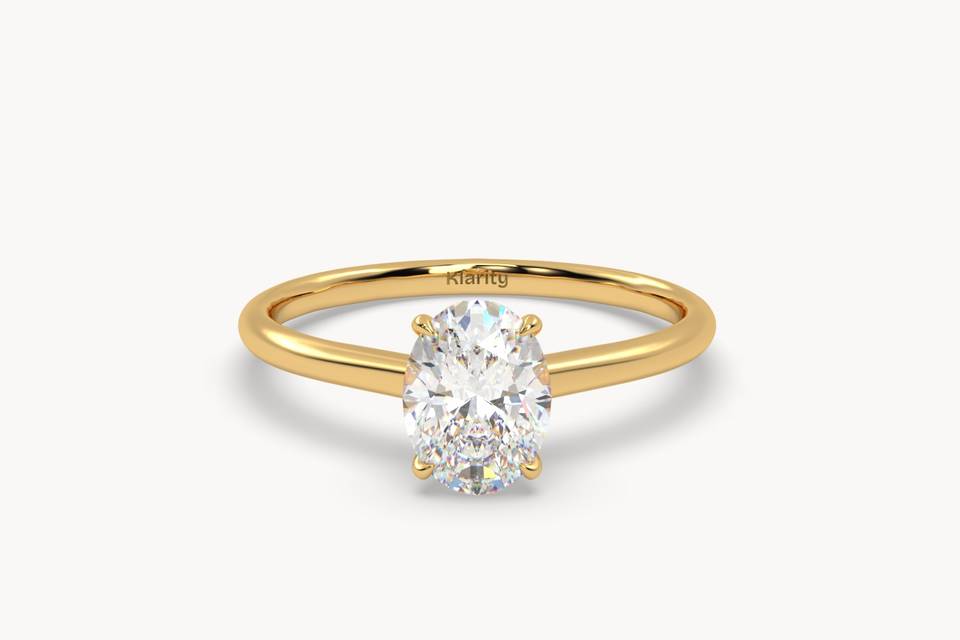 Oval solitaire engagement ring in yellow gold