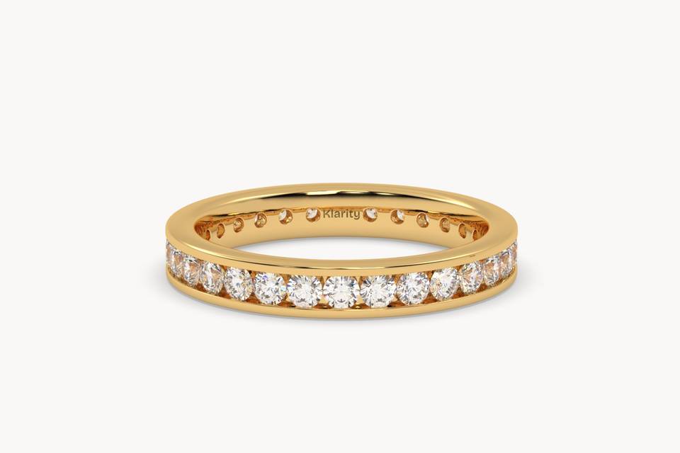Channel-set diamond eternity ring in yellow gold
