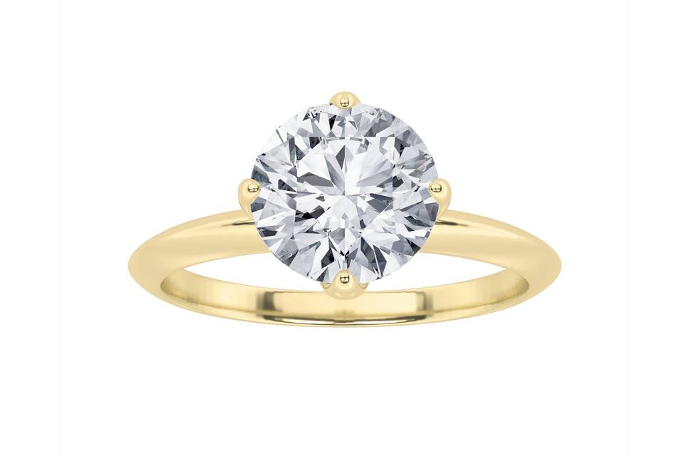Round solitaire engagement ring in yellow gold