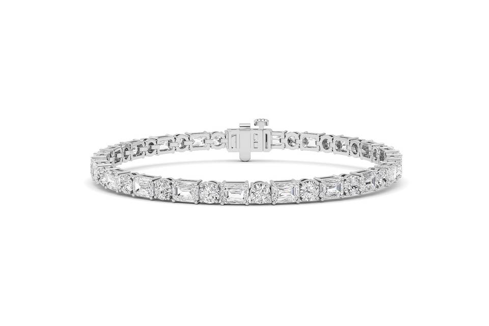 Emerald and round diamond tennis bracelet in white gold