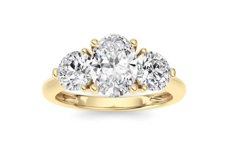 Oval three-stone diamond ring in yellow gold