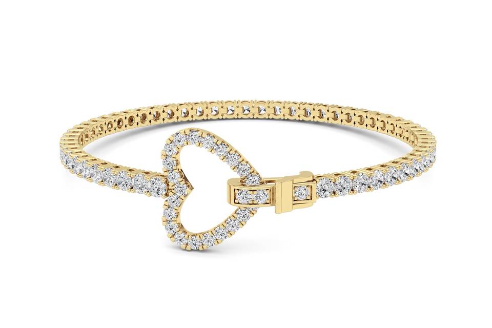 Heart diamond tennis bracelet in yellow gold