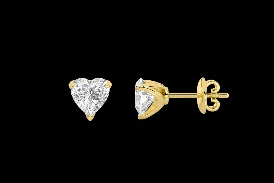 Heart-shaped diamond stud earrings in yellow gold