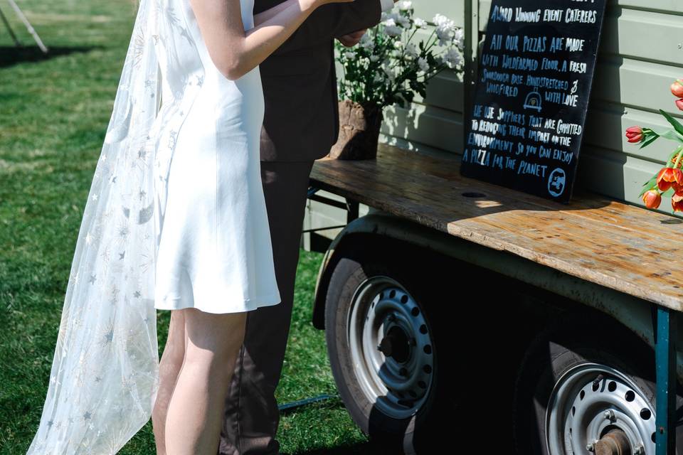 Bride & Groom enjoying pizza