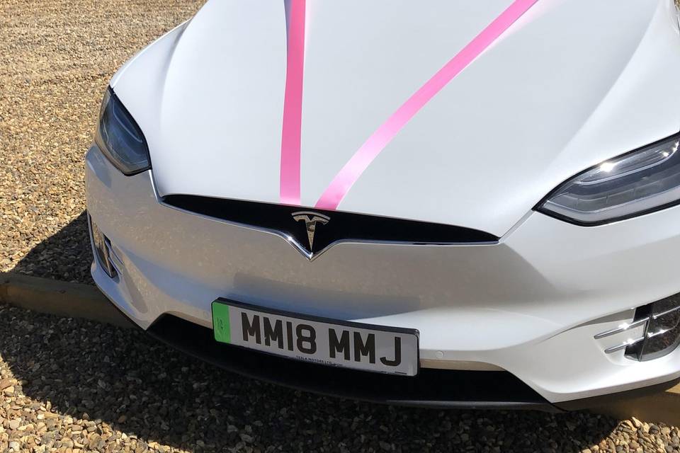 Tesla Model X with pink ribbon