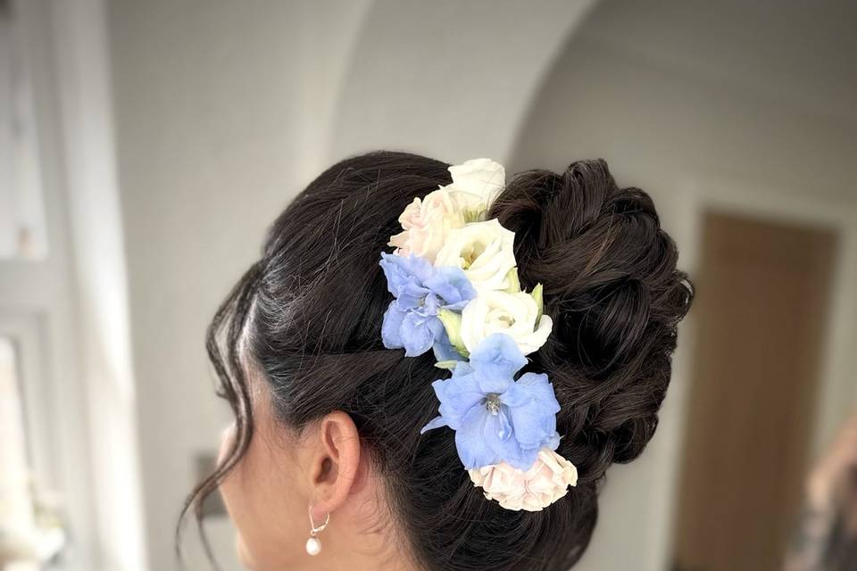 Mid high bun with real flowers