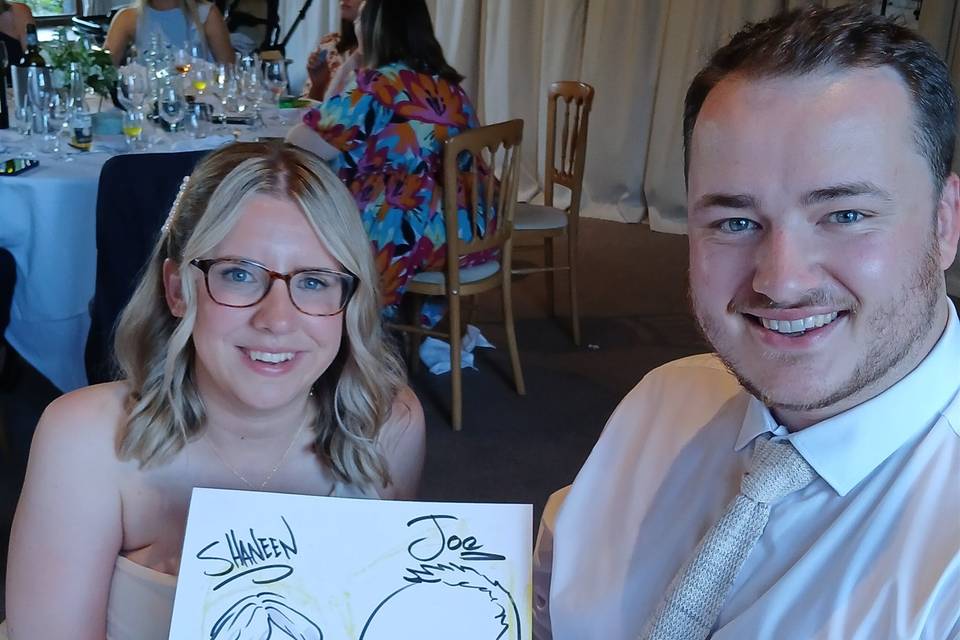 Couple with their caricature