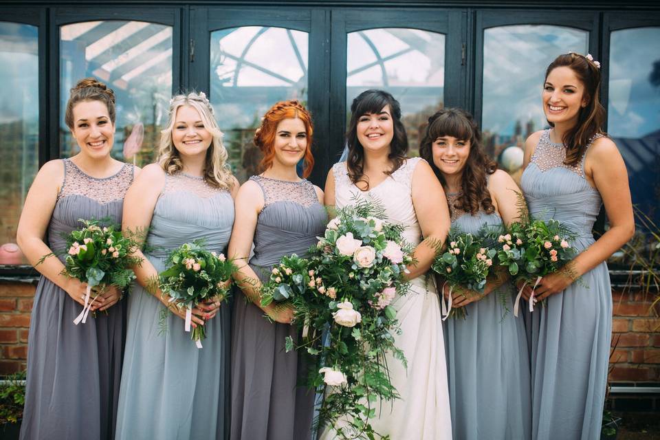 Bridesmaids and Bride smiling