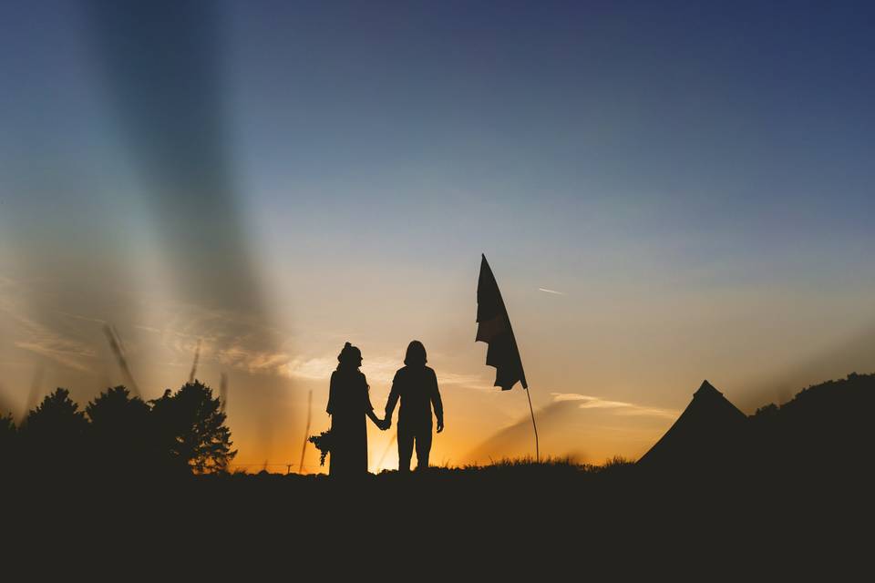 Couple pose sunset