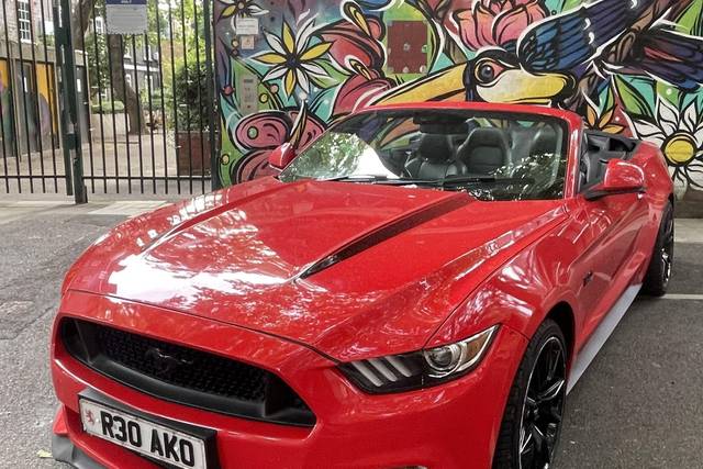 Red Mustang and graffiti.