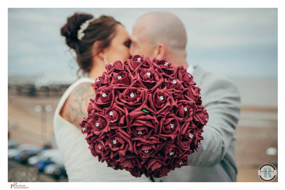 Pair holding bouquet