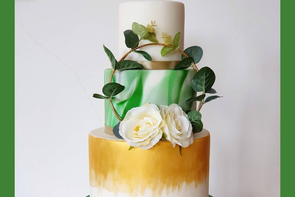 4 tiered cake with floral hoop