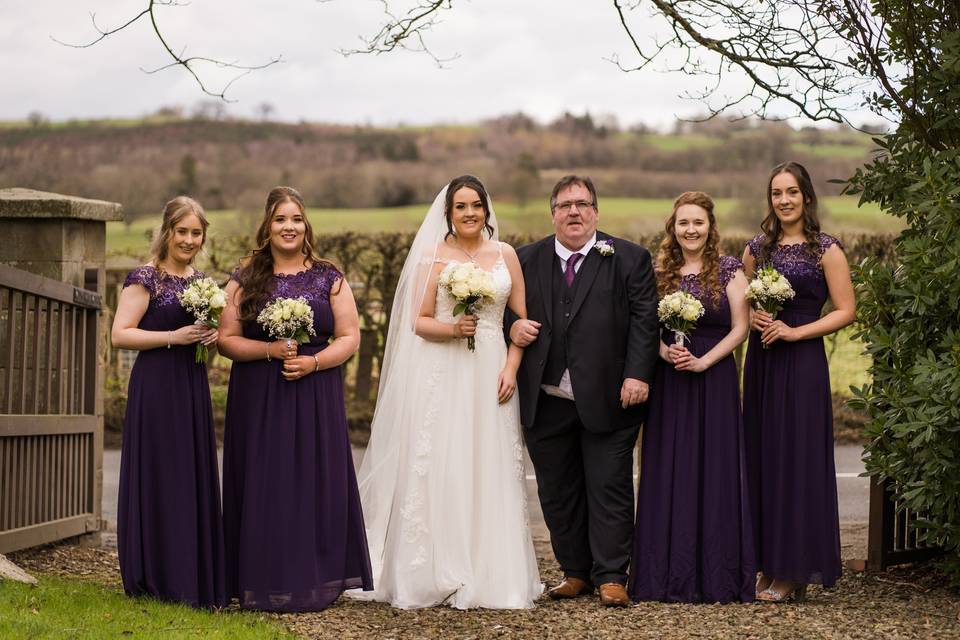 Wedding party holding bouquets