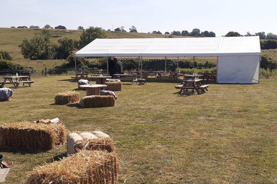 Rustic hay bales and marquee