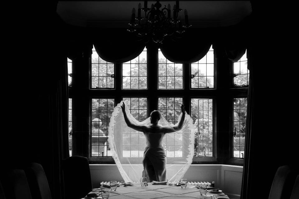 The veil spread wide.