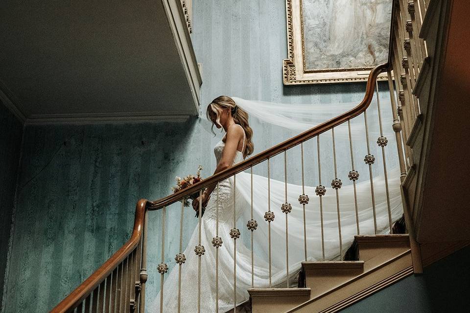 Bride walking down SGH stairs