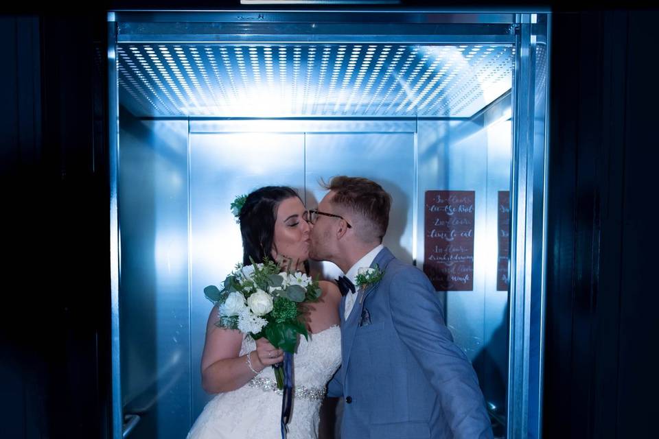 Kiss in lift West Mill Derby