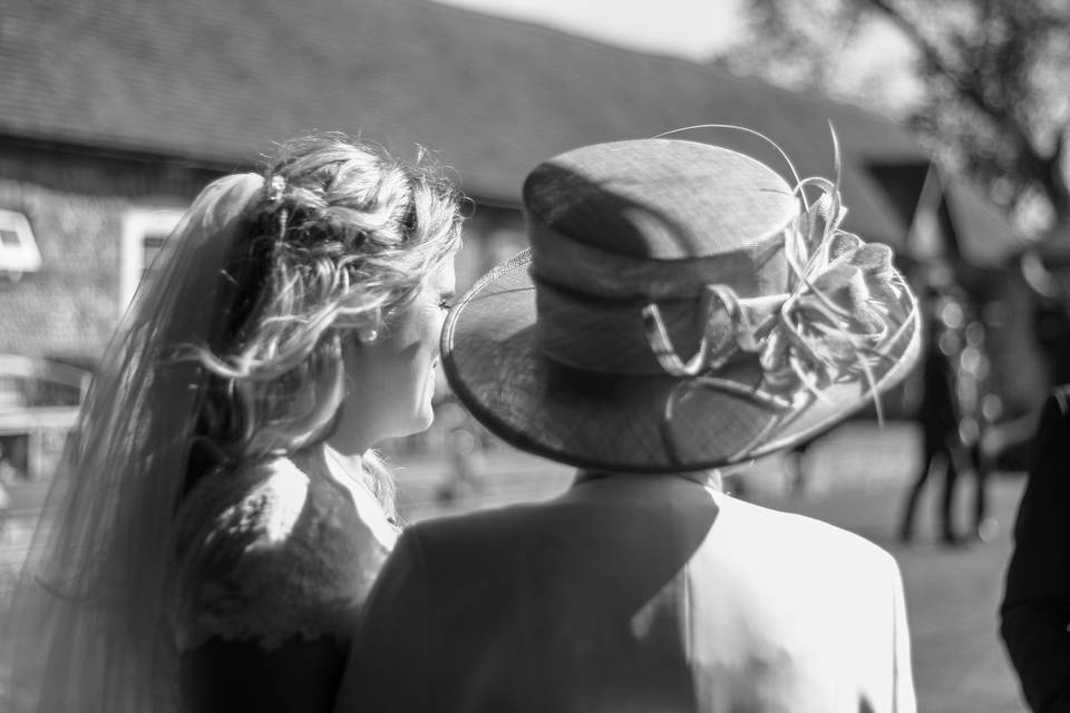 Mother and daughter looking on