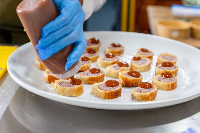 Chef piping appetizers