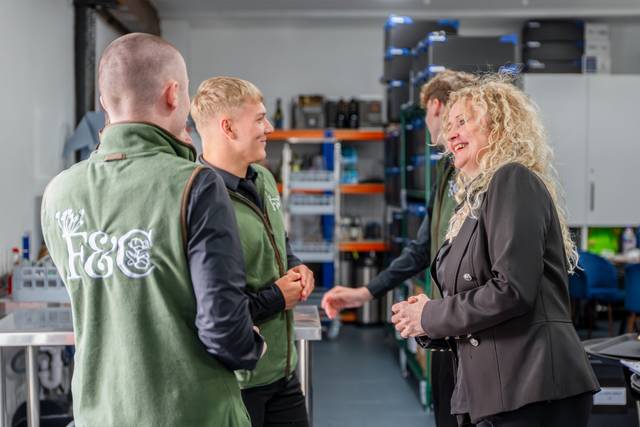 Catering staff members talking together