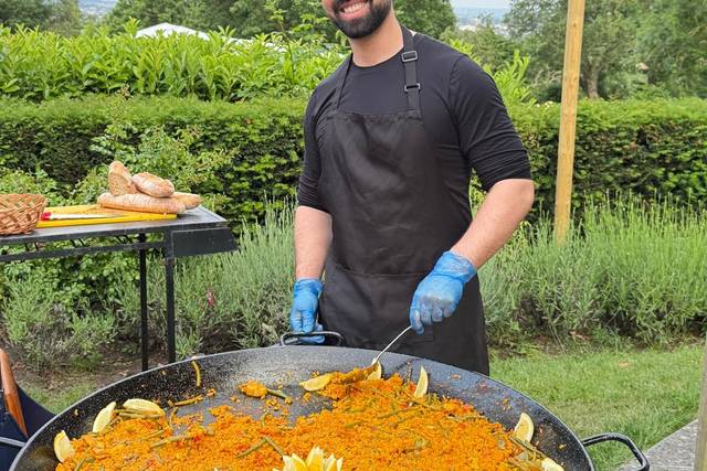 Chef cooking giant paella at g