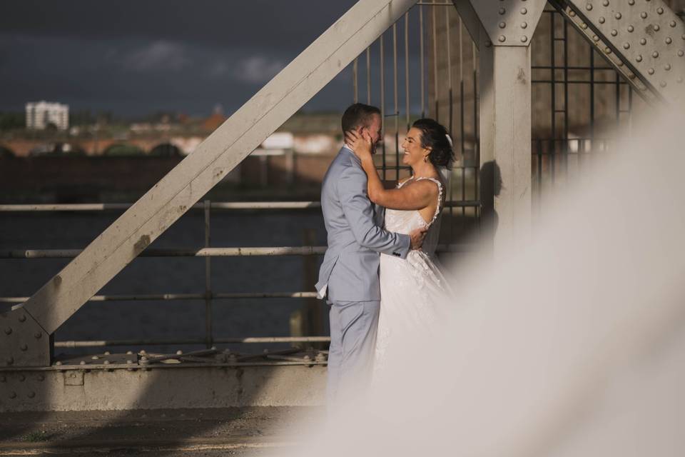 Bride and groom on bridge