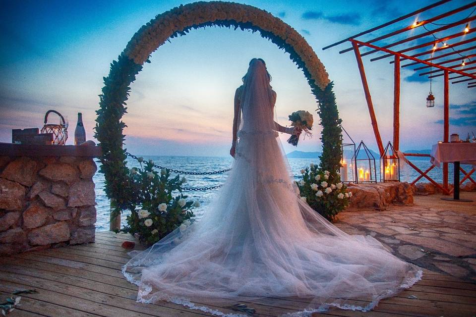 Bride looking out at the water