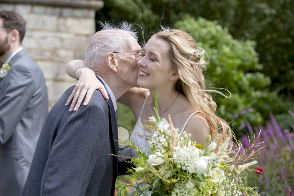 Wedding day hug from grandad