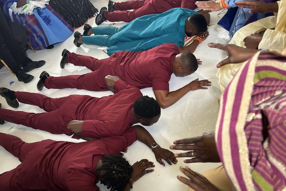 Groom and his men prostrating