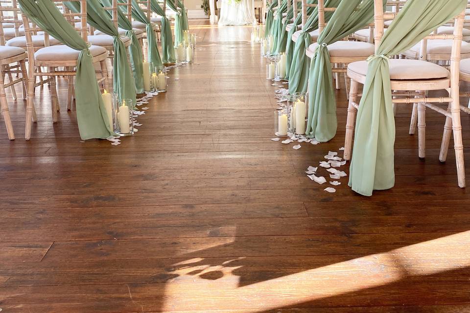 Aisle styling with sage green