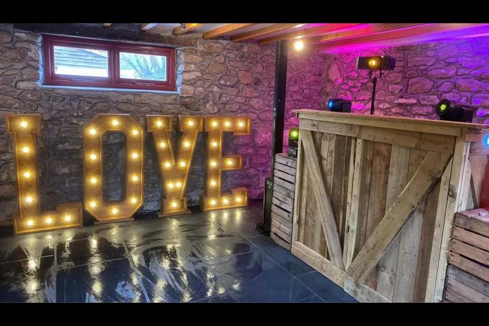 LOVE letters and rustic booth