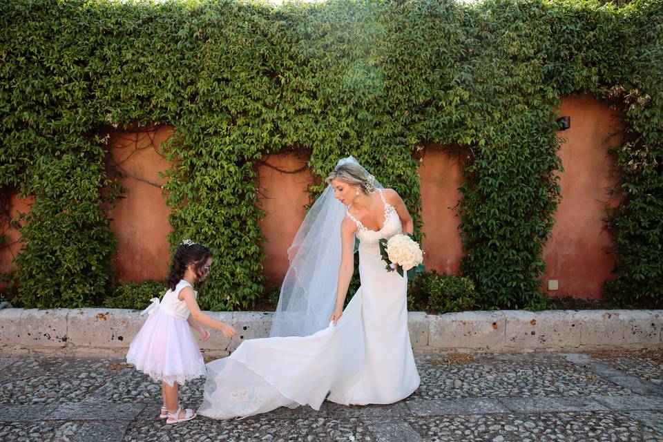 Wedding party member holding the dress