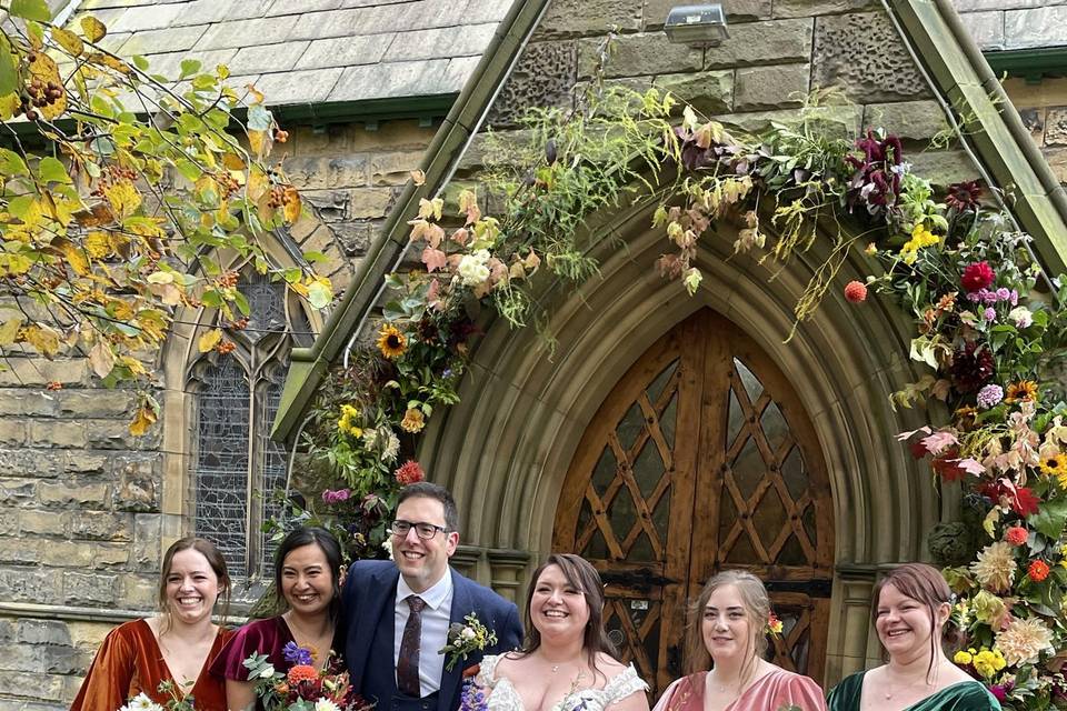 Bouquets, buttonhole and arch