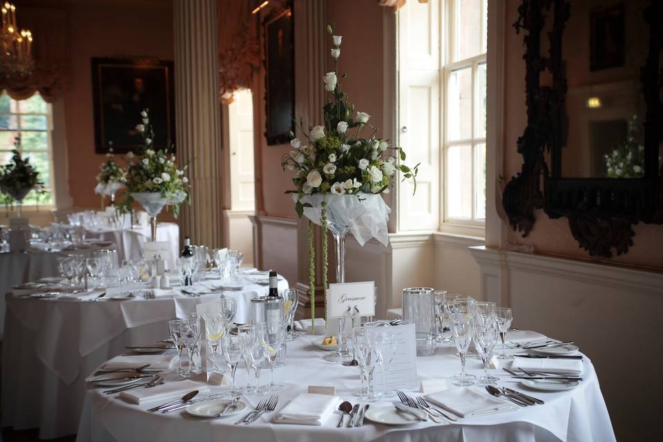 Tall Champagne glasses with floral displays, Hagley Hall, Premier Wedding Venue in the West Midlands and Worcestershire