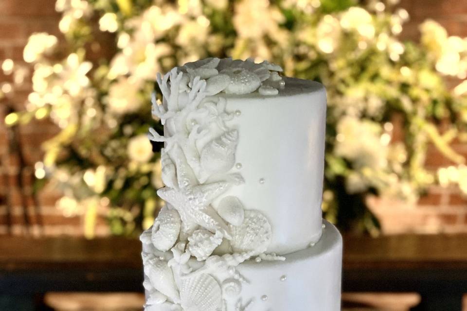 Classic white sea-themed wedding cake