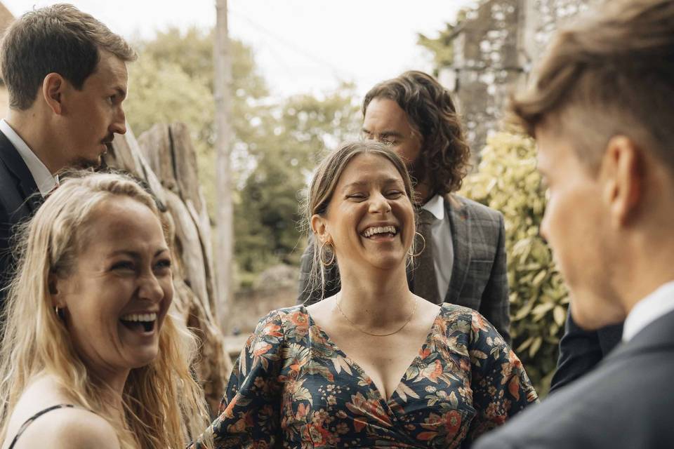 Wedding guests laughing