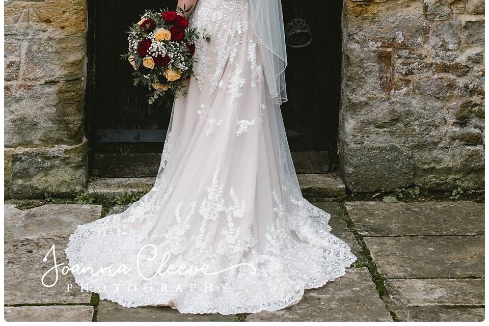 Bride holding a bouquet - Joanna Cleeve