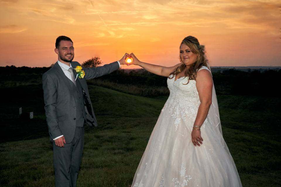 Bride and groom in sunset