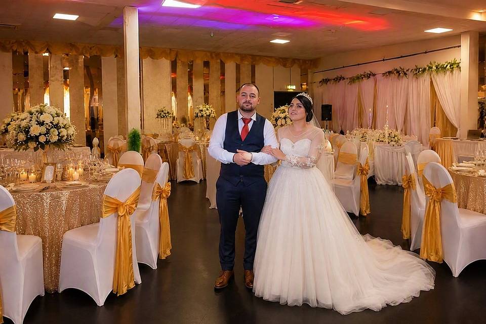 Couple in the gold ballroom