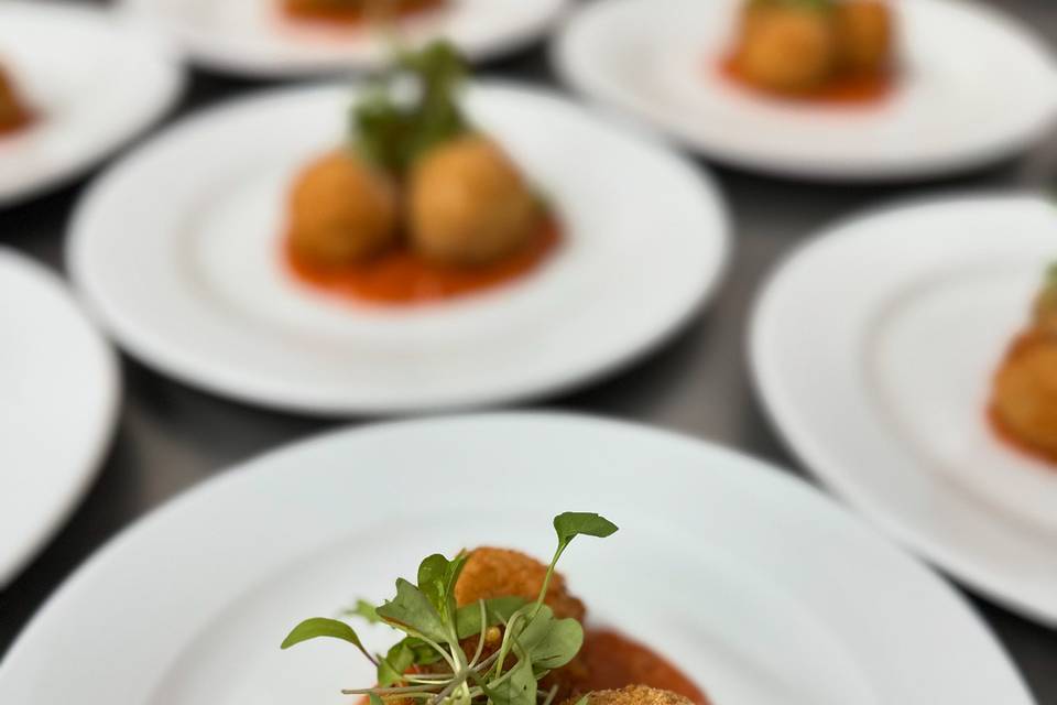 Arancini Starter being plated