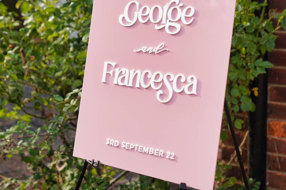 Pink welcome sign