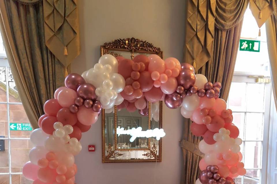 Blushing pink balloon arch