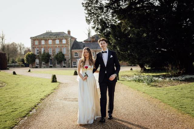 Bride and groom hold hands