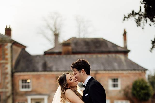 A bride and groom embrace