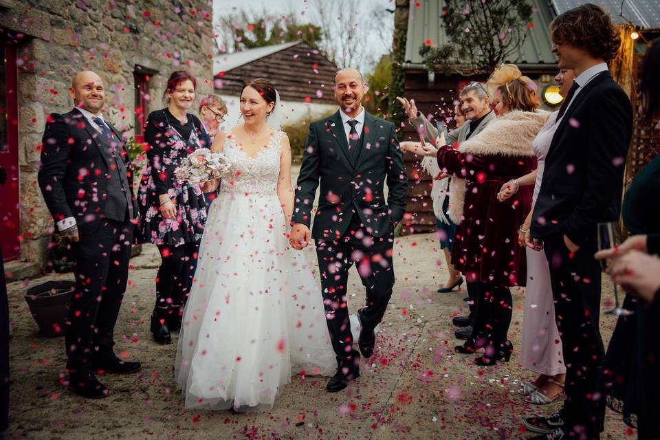 Bride and groom confetti walk