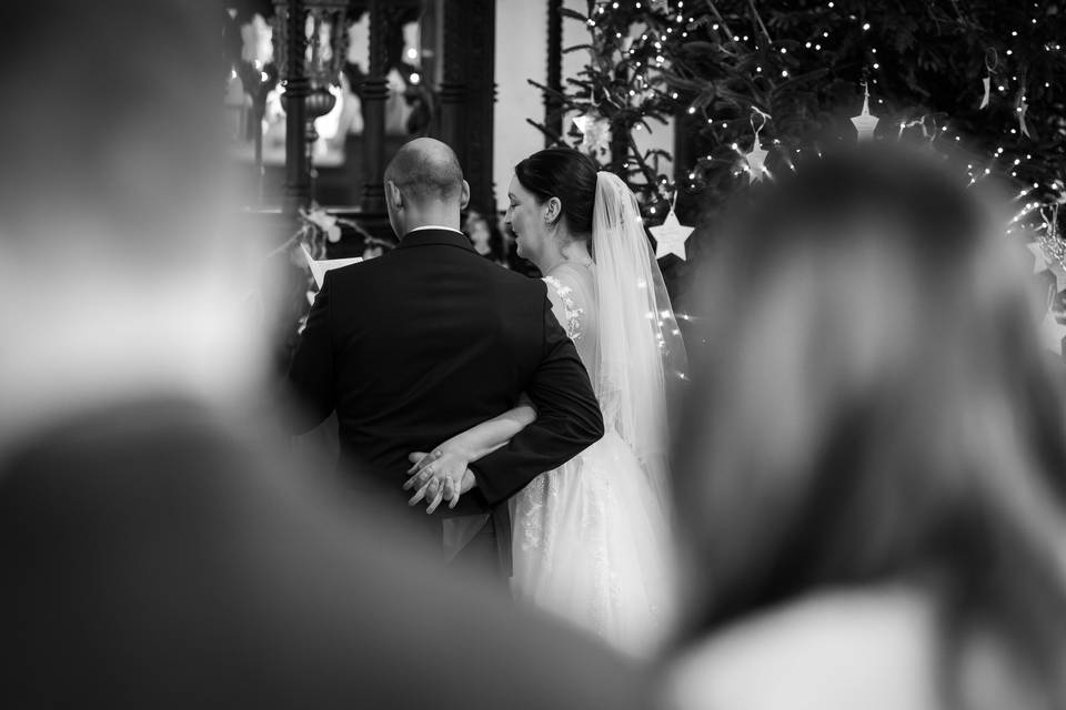 Bride and groom hold hands