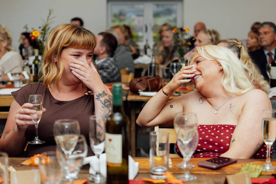 Guests laugh during speeches