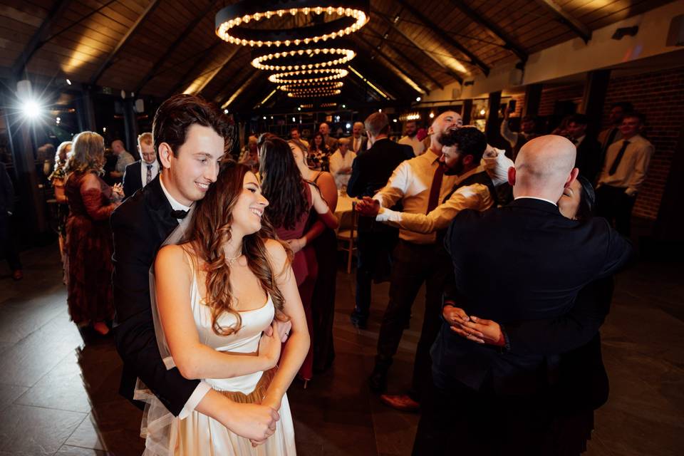 Bride and groom dance together
